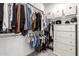 Walk-in closet featuring ample hanging space, shelves, and a dresser for organized storage solutions at 4562 S Park Grove St # 101, Gilbert, AZ 85297