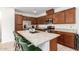 Well-equipped kitchen boasting stainless steel appliances, ample cabinet space, and a spacious granite island at 4562 S Park Grove St # 101, Gilbert, AZ 85297