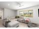Stylish living room with neutral colors, comfortable seating, and a large window for natural light at 4562 S Park Grove St # 101, Gilbert, AZ 85297