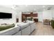 Open-concept living area with views of the kitchen and dining space, perfect for entertaining at 4562 S Park Grove St # 101, Gilbert, AZ 85297