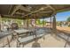 Community pavilion with picnic tables and outdoor grilling area, next to the community playground at 4562 S Park Grove St # 101, Gilbert, AZ 85297
