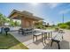 Community pavilion with picnic tables and BBQ grills, perfect for outdoor gatherings and Gathering fun at 4562 S Park Grove St # 101, Gilbert, AZ 85297