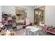 Spacious playroom featuring a whiteboard, toys, and outdoor access, ideal for creative activities and fun at 4562 S Park Grove St # 101, Gilbert, AZ 85297