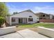 Well-maintained backyard with patio, desert landscaping, and stucco exterior at 4566 E La Costa Dr, Chandler, AZ 85249