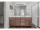 Bathroom featuring vanity with double sinks and a glass door shower at 4566 E La Costa Dr, Chandler, AZ 85249