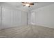 Bedroom with sliding door closet, ceiling fan, and carpet at 4566 E La Costa Dr, Chandler, AZ 85249