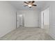 Carpeted bedroom with neutral walls, ceiling fan and ensuite bathroom at 4566 E La Costa Dr, Chandler, AZ 85249