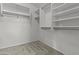 Walk-in closet with built-in shelving and carpeted floor at 4566 E La Costa Dr, Chandler, AZ 85249