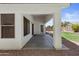 The covered patio is perfect for outdoor living with views of the lush backyard at 4566 E La Costa Dr, Chandler, AZ 85249