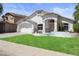 Charming single-story home features stucco siding, manicured lawn and covered front porch at 4566 E La Costa Dr, Chandler, AZ 85249