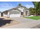 This home has a pristine, stucco exterior, a two-car garage and mature trees at 4566 E La Costa Dr, Chandler, AZ 85249