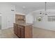 Kitchen with central island, tile floor, archway and stainless appliances at 4566 E La Costa Dr, Chandler, AZ 85249