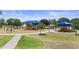 Community playground featuring colorful play structures, covered picnic areas, and green spaces at 4566 E La Costa Dr, Chandler, AZ 85249