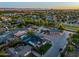 Wide angle shot of a suburban neighborhood, highlighting the modern two-story home with manicured lawn at 4813 E Earll Dr, Phoenix, AZ 85018