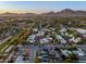 Expansive aerial view of a residential area with mountain views, showcasing many well maintained Gathering homes at 4813 E Earll Dr, Phoenix, AZ 85018