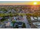 Expansive aerial view of a residential neighborhood at sunset with tree lined streets and lush green landscaping at 4813 E Earll Dr, Phoenix, AZ 85018