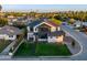 Stunning aerial view of the modern residence, showcasing professional landscaping, roof, and neighborhood at 4813 E Earll Dr, Phoenix, AZ 85018
