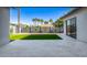 A view of the backyard that features green grass, decorative rock, a patio, and a block wall for added privacy at 4813 E Earll Dr, Phoenix, AZ 85018