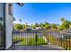 Wide view from black iron balcony showing mountain view, green landscaping, blue skies, and palm trees at 4813 E Earll Dr, Phoenix, AZ 85018