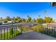 Balcony featuring mountain view, green landscaping, blue skies, and black iron railing at 4813 E Earll Dr, Phoenix, AZ 85018