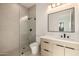 Modern bathroom with glass shower, sleek vanity, and stylish fixtures at 4813 E Earll Dr, Phoenix, AZ 85018