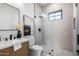 Modern bathroom with glass shower, decorative art, and stylish vanity at 4813 E Earll Dr, Phoenix, AZ 85018