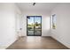 Bright bedroom featuring hardwood floors and sliding door to balcony with a view at 4813 E Earll Dr, Phoenix, AZ 85018