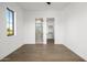 Bedroom features hardwood floors and access to bathroom and closet at 4813 E Earll Dr, Phoenix, AZ 85018