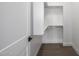 Modern, bright closet with hardwood floors and shelving at 4813 E Earll Dr, Phoenix, AZ 85018