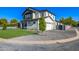 Well-maintained home with a spacious garage, gravel lawn, and green backyard at 4813 E Earll Dr, Phoenix, AZ 85018