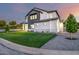 Beautiful two-story house with a modern design, green lawn, and attractive landscaping at 4813 E Earll Dr, Phoenix, AZ 85018