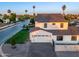 Stunning two-story home showcasing modern architectural design, a manicured lawn, and a spacious three car garage at 4813 E Earll Dr, Phoenix, AZ 85018