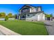 A modern home featuring a green lawn with a pathway and tasteful landscaping in daytime at 4813 E Earll Dr, Phoenix, AZ 85018