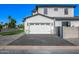 Modern home featuring a two-car garage, brick driveway, and neutral stucco exterior for curb appeal at 4813 E Earll Dr, Phoenix, AZ 85018