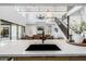 Bright kitchen with white countertops, modern appliances, and open concept living space at 4813 E Earll Dr, Phoenix, AZ 85018