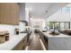Open kitchen layout with modern appliances and a view of the dining and living areas at 4813 E Earll Dr, Phoenix, AZ 85018