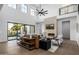 Elegant living room with high ceilings, modern fireplace, and seamless indoor-outdoor living at 4813 E Earll Dr, Phoenix, AZ 85018