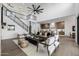 Bright open-concept living room with soaring ceilings leads into a modern kitchen area at 4813 E Earll Dr, Phoenix, AZ 85018