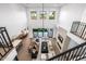 Spacious living room with high ceilings, fireplace, and large windows at 4813 E Earll Dr, Phoenix, AZ 85018