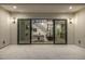 A view from the patio into the home that shows a living room with modern furnishings at 4813 E Earll Dr, Phoenix, AZ 85018