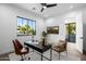 Stylish home office boasting an oversized window and sleek modern decor at 4813 E Earll Dr, Phoenix, AZ 85018