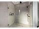 A glass shower with sleek, gray tiling and modern fixtures, and black hardware at 4813 E Earll Dr, Phoenix, AZ 85018