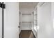 A walk-in closet with ample shelving and hanging storage provides an organized space at 4813 E Earll Dr, Phoenix, AZ 85018