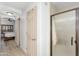 Bright bathroom with a glass enclosed shower and a glimpse into an adjacent bedroom at 5350 E Deer Valley Dr # 1419, Phoenix, AZ 85054