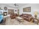 Cozy living room with a fireplace, leather sofas, and tile flooring at 5350 E Deer Valley Dr # 1419, Phoenix, AZ 85054
