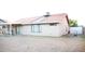 Spacious backyard with covered patio, grass, and block fencing at 5515 E Elena Ave, Mesa, AZ 85206
