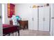 Bedroom with desk, white storage cabinets, and Arizona State decor at 5515 E Elena Ave, Mesa, AZ 85206