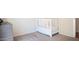 Bedroom with a white baby crib and carpeted floors at 5515 E Elena Ave, Mesa, AZ 85206
