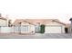 Charming single-story home with a well-manicured lawn, a two-car garage, and a welcoming front porch at 5515 E Elena Ave, Mesa, AZ 85206