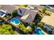 An aerial view showcases a home with a pool, solar panels, and private fenced backyard at 5731 W Gail Dr, Chandler, AZ 85226